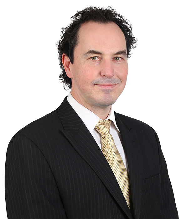 A professional headshot of Eric Albertini