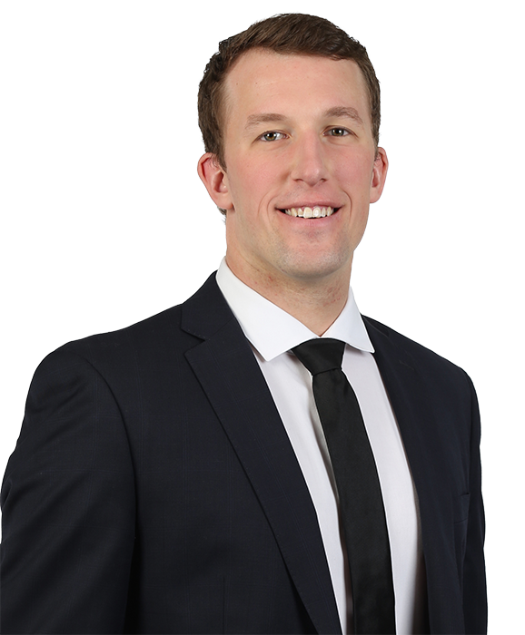 A professional headshot of Adam Crichton